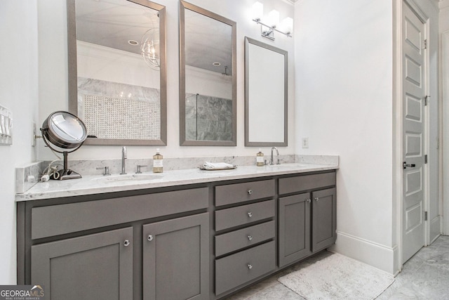 bathroom with crown molding and vanity