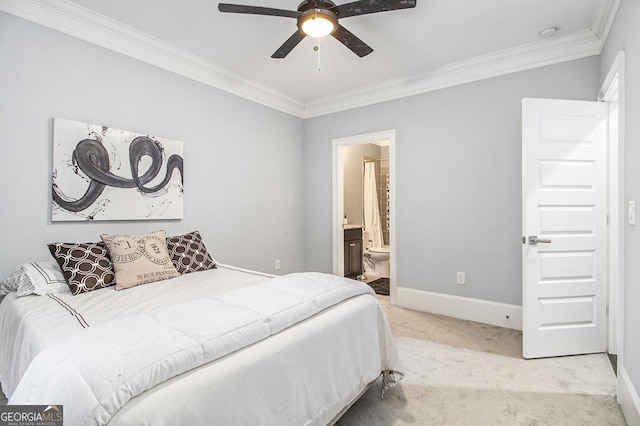 carpeted bedroom featuring ensuite bathroom, crown molding, and ceiling fan