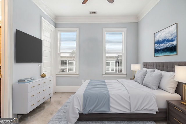 carpeted bedroom with crown molding and ceiling fan