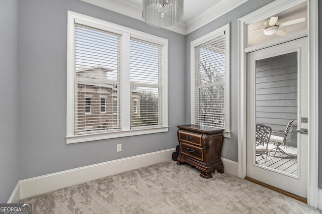 sitting room with crown molding and light colored carpet