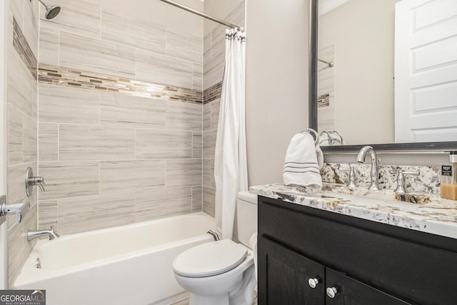 full bathroom featuring shower / tub combo with curtain, vanity, and toilet