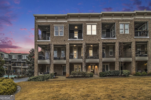 view of outdoor building at dusk