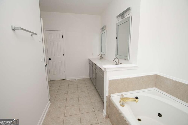 bathroom featuring vanity, tiled bath, and tile patterned floors