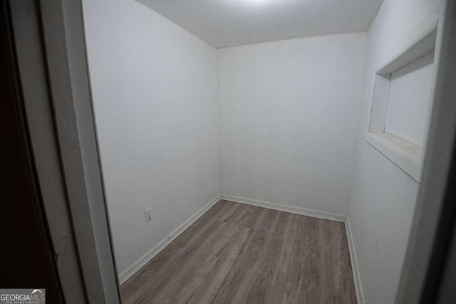 unfurnished room featuring wood-type flooring