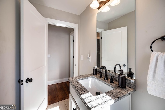 bathroom featuring vanity and hardwood / wood-style flooring