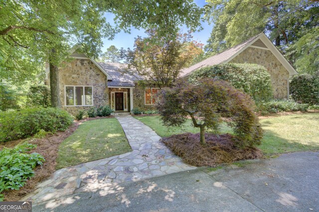 view of front of home with a front yard