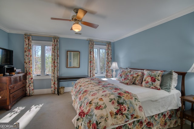 carpeted bedroom featuring ornamental molding, visible vents, ceiling fan, and baseboards