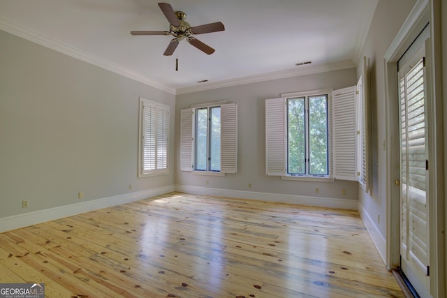 empty room with light wood finished floors, baseboards, ornamental molding, and ceiling fan