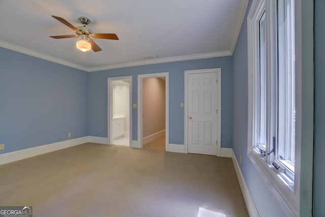 unfurnished bedroom featuring light carpet, baseboards, ensuite bathroom, and crown molding