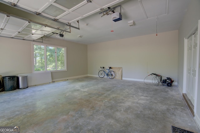 garage featuring baseboards and a garage door opener