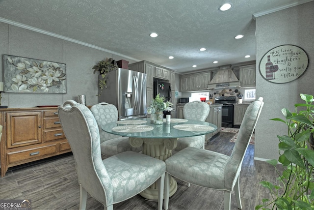 dining area featuring a textured ceiling and ornamental molding