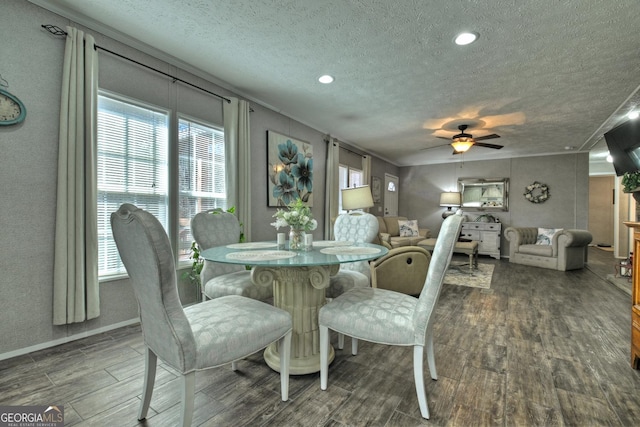 dining room featuring ceiling fan, hardwood / wood-style floors, crown molding, and a textured ceiling