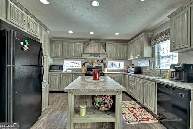 kitchen with custom range hood, sink, a textured ceiling, and black appliances