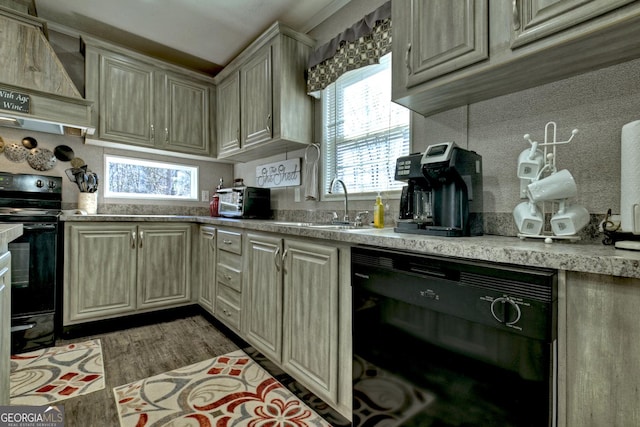 kitchen featuring tasteful backsplash, custom range hood, sink, black appliances, and light hardwood / wood-style floors