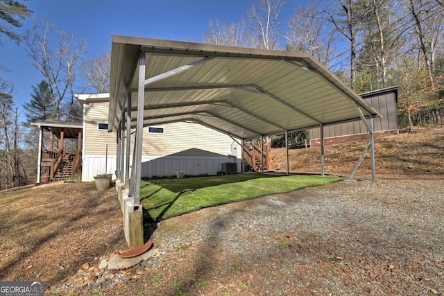 view of parking featuring a carport and a yard