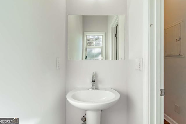 bathroom with electric panel and sink