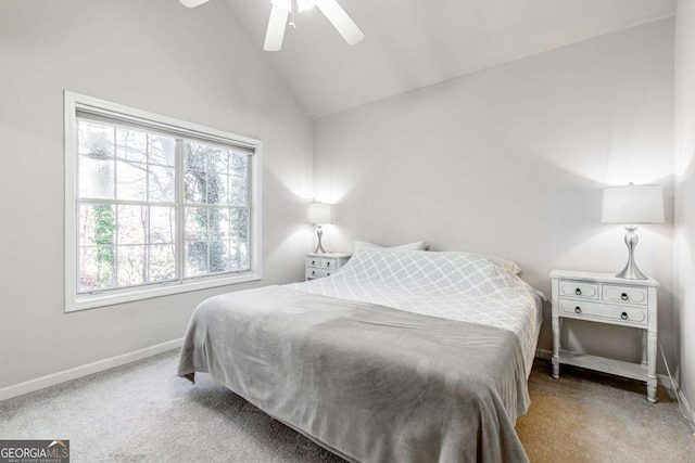 carpeted bedroom featuring multiple windows, high vaulted ceiling, and ceiling fan