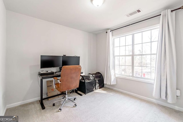 home office featuring light colored carpet