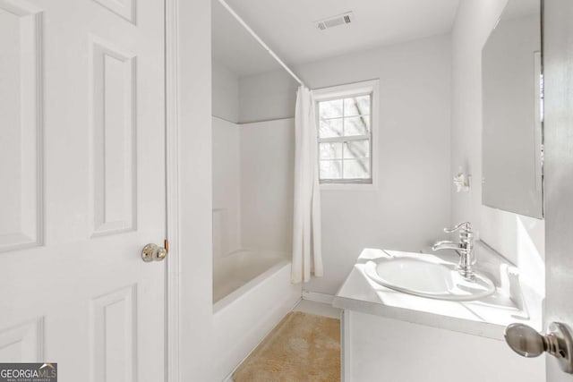 bathroom with vanity and shower / tub combo