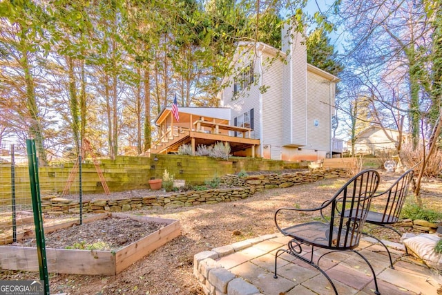 back of house featuring a deck