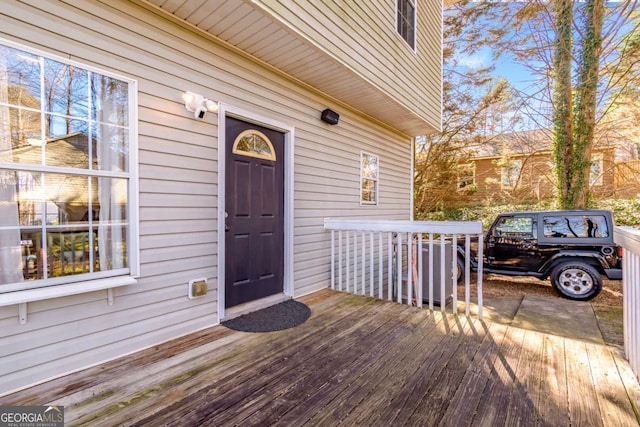 doorway to property featuring a wooden deck