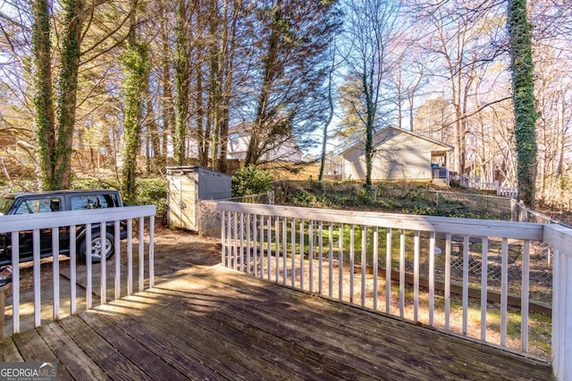 wooden deck featuring a storage shed