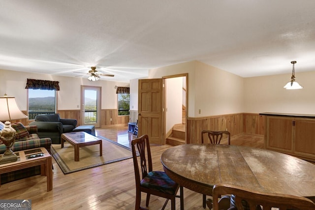 dining room featuring light wood-type flooring and ceiling fan