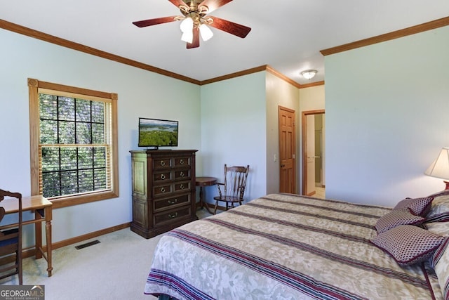 bedroom with light colored carpet, ceiling fan, ornamental molding, and ensuite bathroom