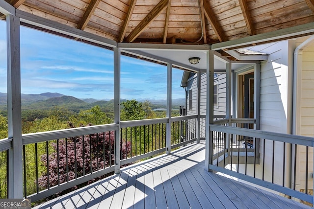 wooden deck with a gazebo and a mountain view