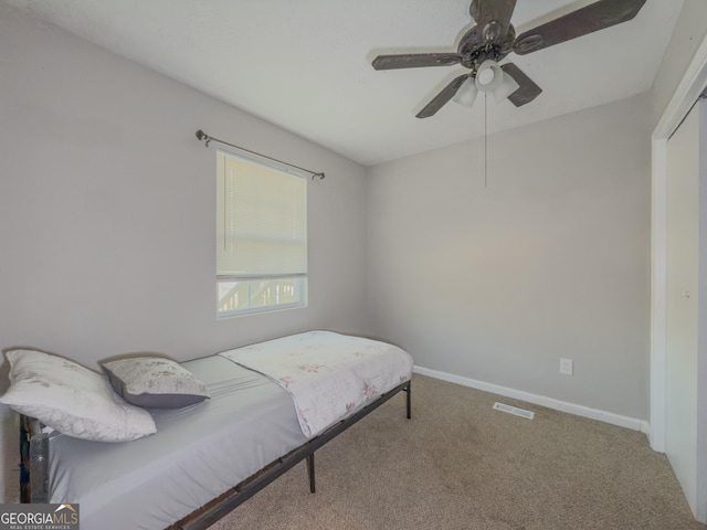 bedroom featuring ceiling fan and carpet floors