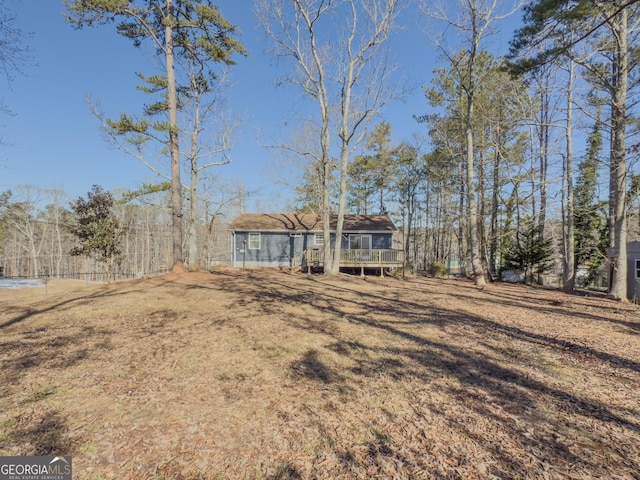 view of yard featuring a wooden deck