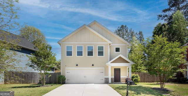 view of front of house featuring a front yard and a garage