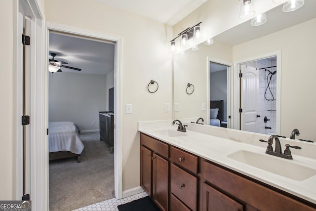 bathroom with ceiling fan and vanity