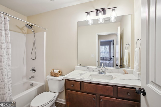 full bathroom featuring vanity, shower / bath combo, and toilet