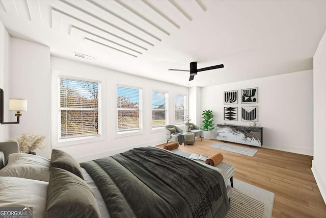 bedroom featuring hardwood / wood-style floors and ceiling fan