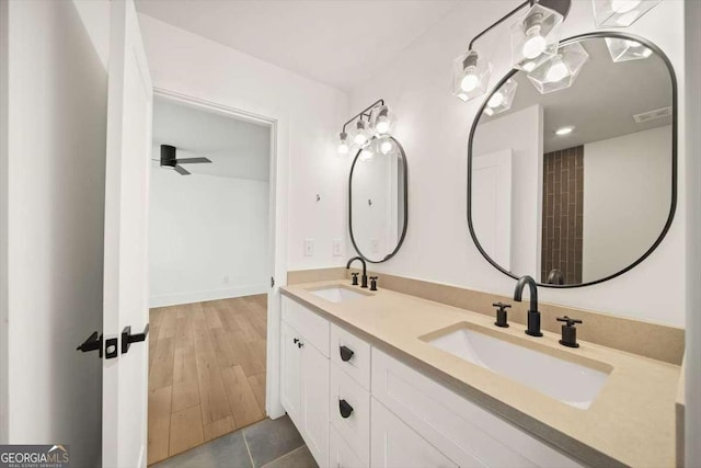 bathroom featuring tile patterned flooring, vanity, and ceiling fan