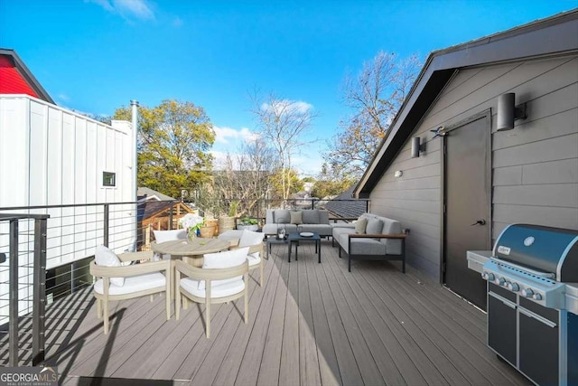 deck featuring an outdoor living space and a grill