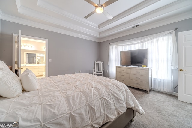 bedroom featuring ensuite bath, ceiling fan, crown molding, carpet floors, and a tray ceiling