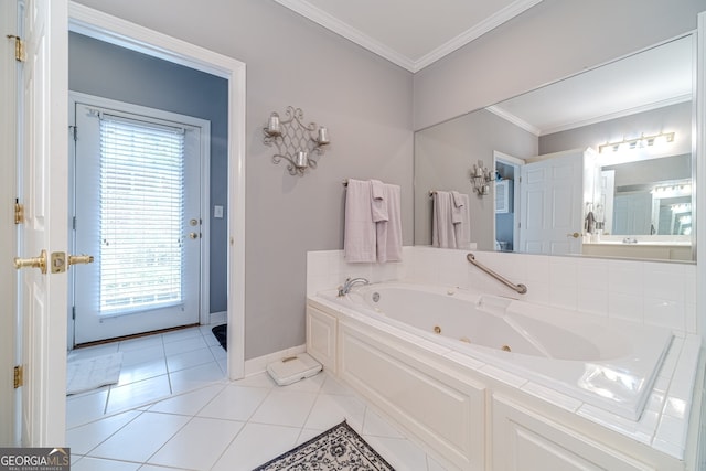 bathroom featuring a wealth of natural light, crown molding, tile patterned flooring, and a bathing tub