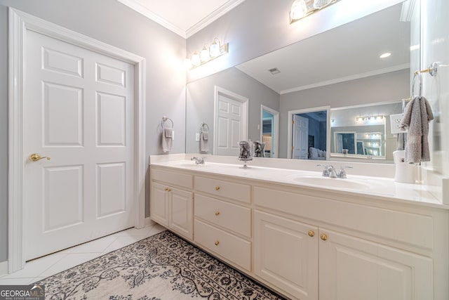 bathroom featuring tile patterned floors, crown molding, and vanity