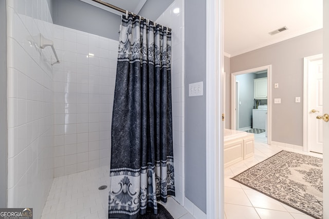 bathroom featuring tile patterned floors, crown molding, and walk in shower