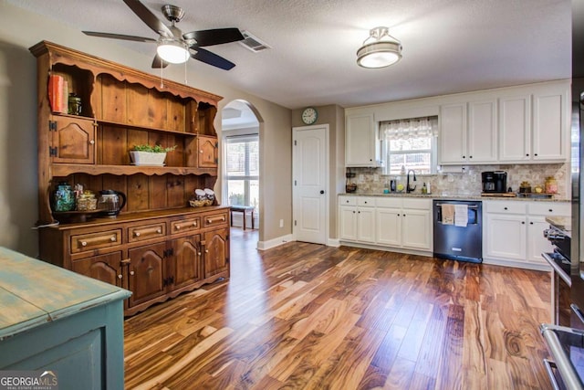 kitchen with white cabinetry, sink, dark wood-type flooring, and stainless steel appliances