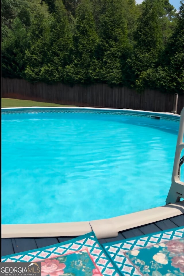 view of pool featuring a fenced in pool and fence