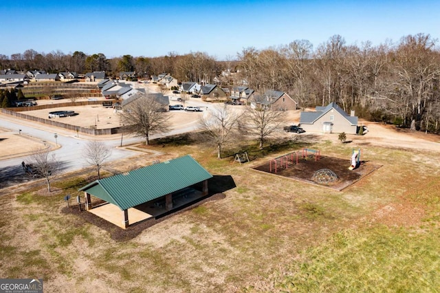 birds eye view of property with a residential view