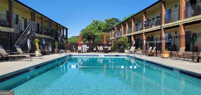 view of swimming pool with a patio area