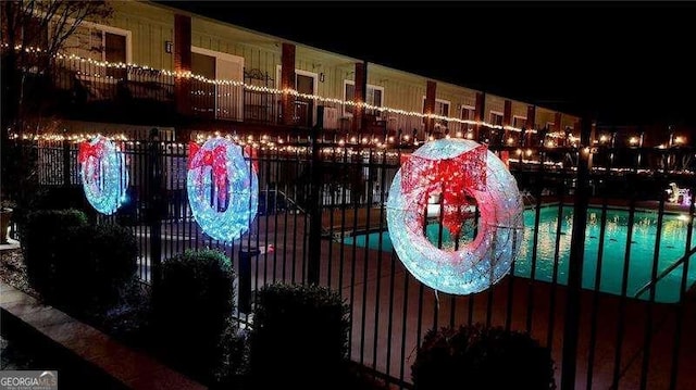 view of pool at night