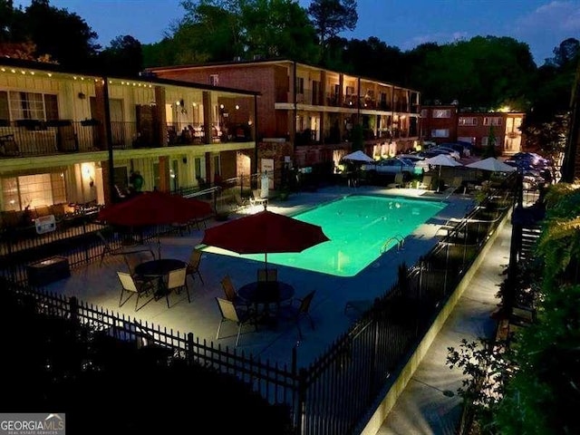 view of swimming pool with a patio area