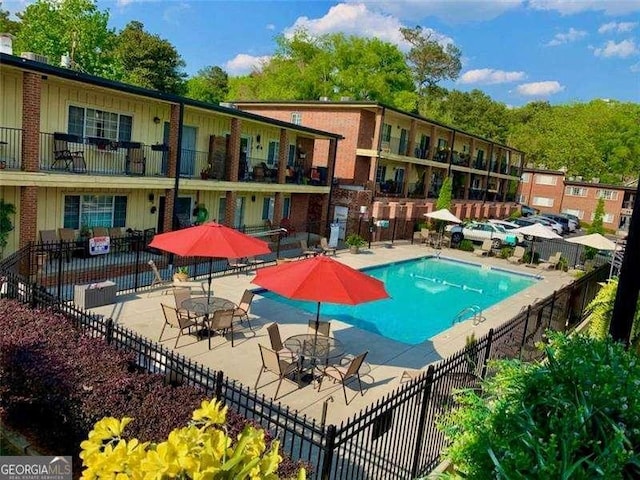 view of pool featuring a patio area