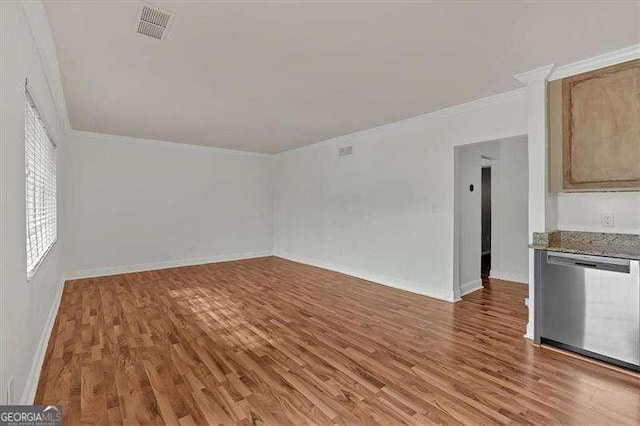 interior space with hardwood / wood-style floors and ornamental molding