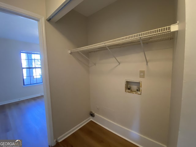 laundry area with hookup for a washing machine, dark hardwood / wood-style flooring, and gas dryer hookup